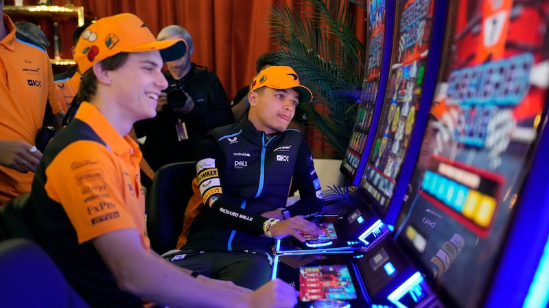 McLaren driver Oscar Piastri, of Australia, left, and McLaren driver Lando Norris, of Britain,...