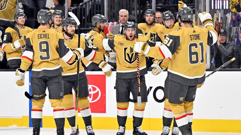 Vegas Golden Knights right wing Jonathan Marchessault, center, celebrates after his power play...