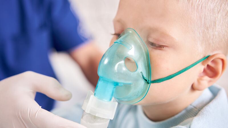 Child uses nebulizer (FILE)