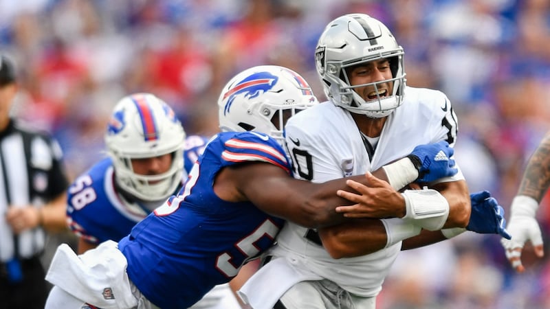 Buffalo Bills defensive end Greg Rousseau (50) tackles Las Vegas Raiders quarterback Jimmy...