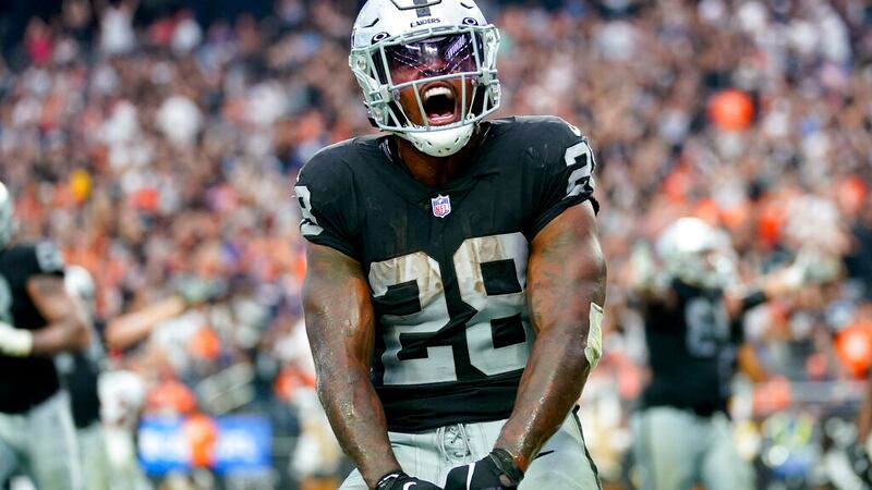 Las Vegas Raiders running back Josh Jacobs (28) celebrates his touchdown against the Denver...
