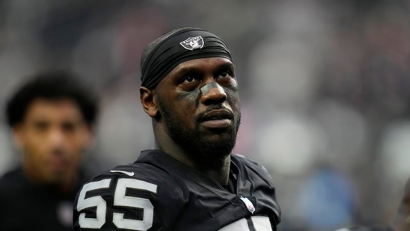 FILE - Las Vegas Raiders defensive end Chandler Jones (55) warms up before an NFL football...