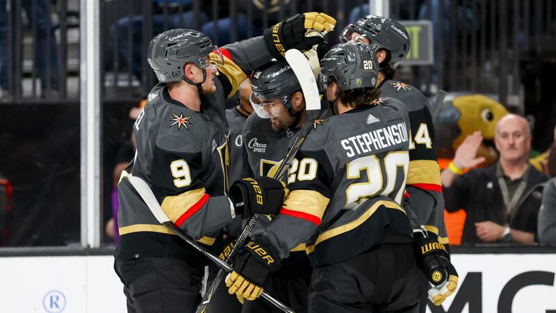 Vegas Golden Knights centers Jack Eichel (9) and Chandler Stephenson (20) celebrate with Vegas...
