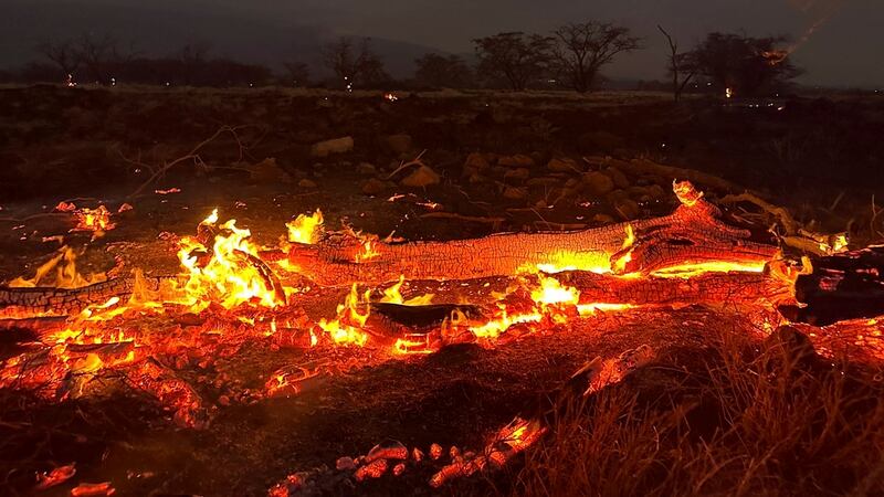 A wildfire burns in Kihei, Hawaii late Wednesday, Aug. 9, 2023. Thousands of residents raced...