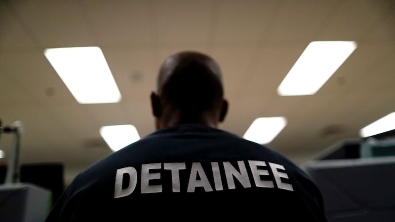 A detainee sits at the Otay Mesa Detention Center Wednesday, Aug. 23, 2017, in San Diego. The...