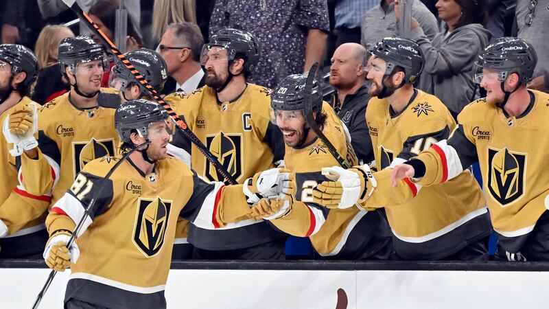 Vegas Golden Knights right wing Jonathan Marchessault (81) celebrates with the bench his...