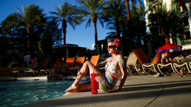 A woman who goes by "Martha War" sits by the pool during the Viva Las Vegas Rockabilly Weekend...