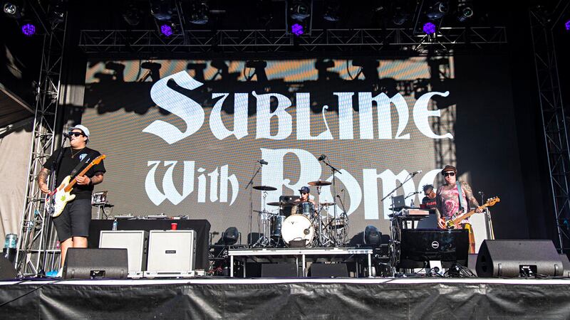 Rome Ramirez, from left, Carlos Verdugo, and Eric Wilson of Sublime with Rome perform during...