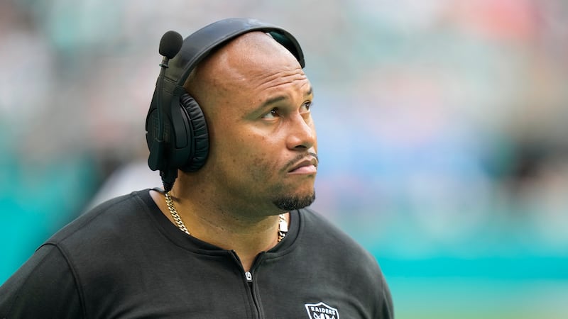 Las Vegas Raiders head coach Antonio Pierce watches the game during the second half of an NFL...