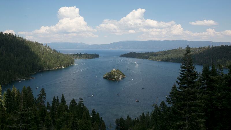 FILE - Boats ply the waters of Emerald Bay of Lake Tahoe, near South Lake Tahoe, Calif., Aug....
