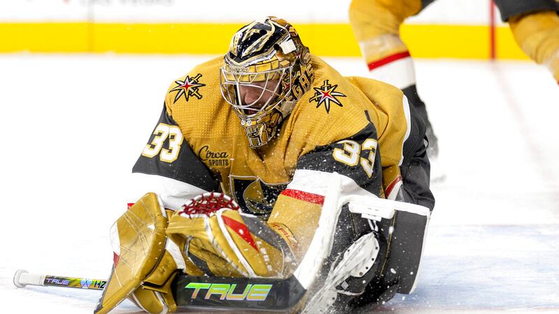 Vegas Golden Knights goaltender Adin Hill (33) misses the puck, which stayed out of the goal...