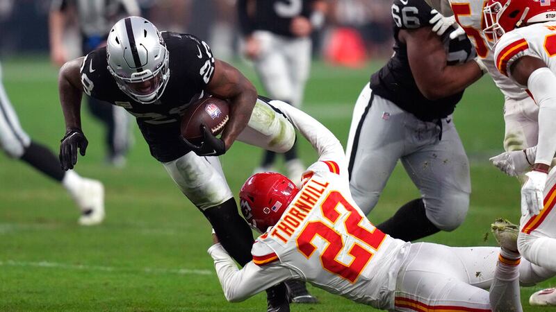 Las Vegas Raiders running back Josh Jacobs (28) as Kansas City Chiefs safety Juan Thornhill...