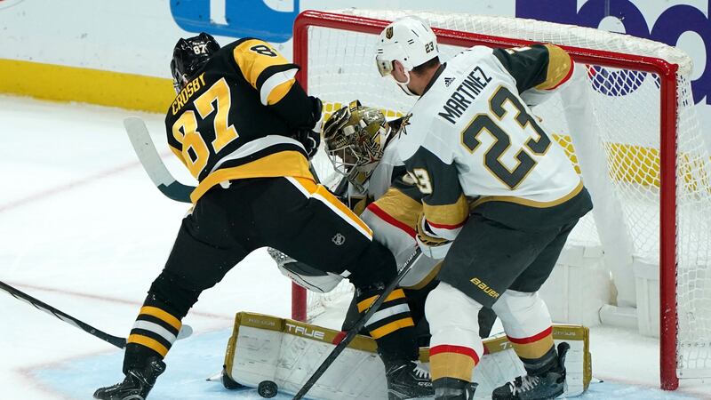 Vegas Golden Knights goaltender Adin Hill blocks a shot in front of Pittsburgh Penguins'...