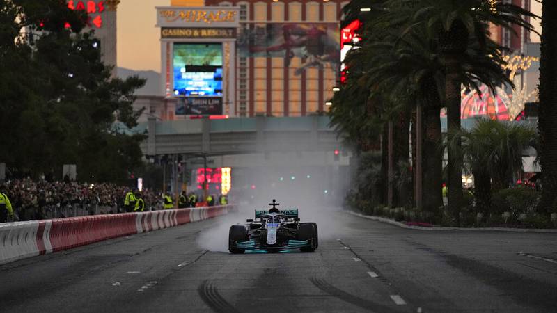 Mercedes' George Russell drives during a demonstration along the Las Vegas Strip at a launch...